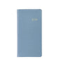 A light blue, textured, Smyth sewn hardcover from the Graphic Image 2026 Pocket Journal Planner Collection features "2026" embossed in gold on the front.