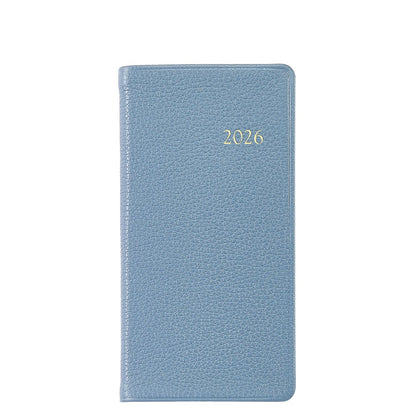 A light blue, textured, Smyth sewn hardcover from the Graphic Image 2026 Pocket Journal Planner Collection features "2026" embossed in gold on the front.