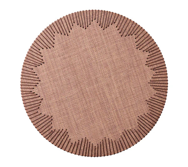 The Dream Weaver Placemat by Kim Seybert features a round, textured woven design in light brown with a sunburst pattern of raised lines—an ideal accent for summer entertaining.