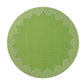 The Kim Seybert Dream Weaver Placemat features a round green woven design with a textured surface and symmetrical white accents—ideal for summer entertaining.