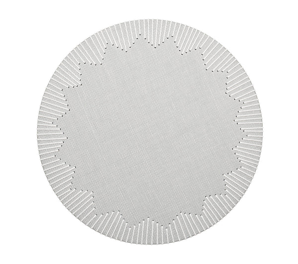 The Kim Seybert Dream Weaver Placemat is a circular white placemat with a textured surface, notched edge, and starburst center—ideal for summer entertaining.
