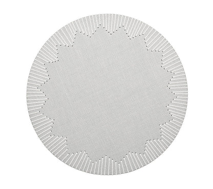 The Kim Seybert Dream Weaver Placemat is a circular white placemat with a textured surface, notched edge, and starburst center—ideal for summer entertaining.
