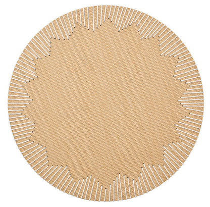 The Kim Seybert Dream Weaver Placemat features a round beige design with scalloped edges and white stitched accents radiating inward, making it a chic choice for stylish summer entertaining.