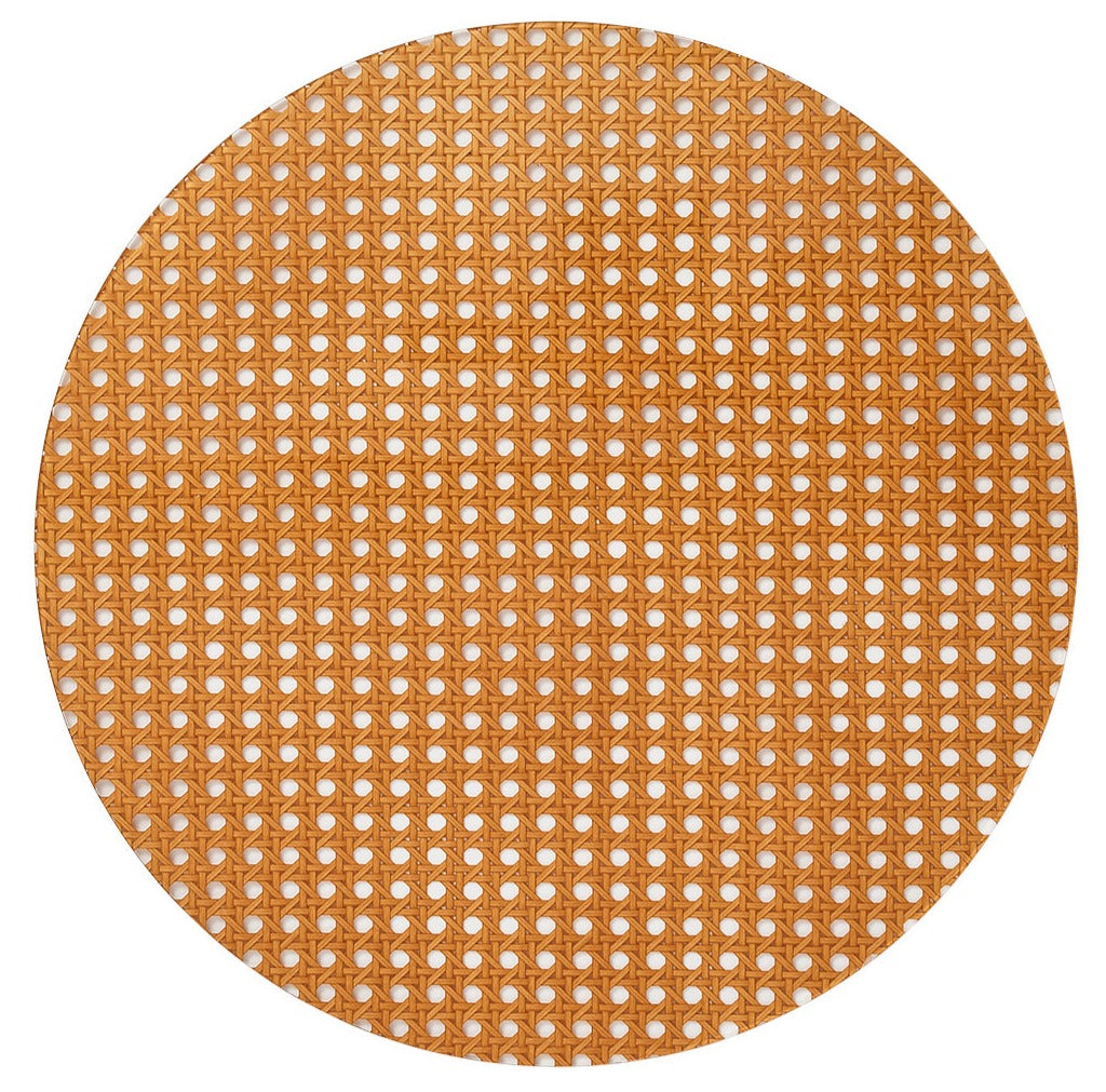 The Kim Seybert Reed Placemat features woven cane webbing with a hexagonal lattice pattern, offering a faux-wicker look that's ideal for outdoor entertaining on a white background.
