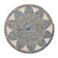 Inspired by the Kim Seybert Majorelle Placemat, this round woven basket lid is crafted from natural seagrass and showcases a geometric blue and white pattern when viewed from above.