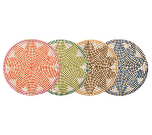 Four Kim Seybert Majorelle Placemats, adorned with geometric patterns in orange, green, brown, and blue, are crafted from natural seagrass. These woven pieces add an earthy touch and subtle floral motifs to any table setting.