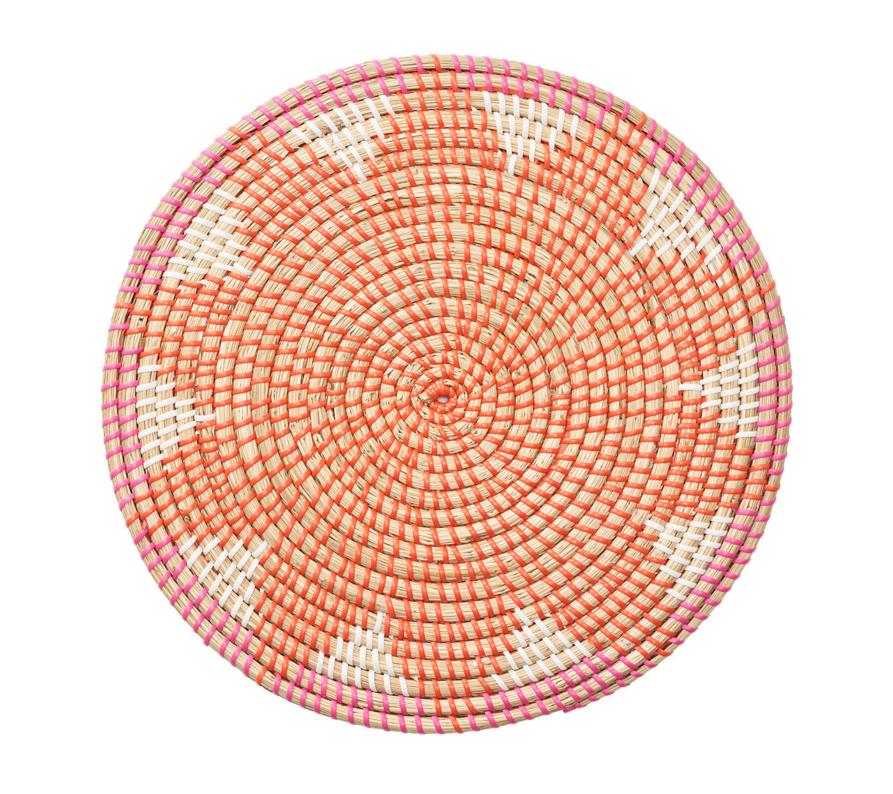 The Majorelle Placemat by Kim Seybert, crafted from natural seagrass, displays an orange, white, and pink geometric pattern with subtle floral motifs. Photographed from above on a white background.