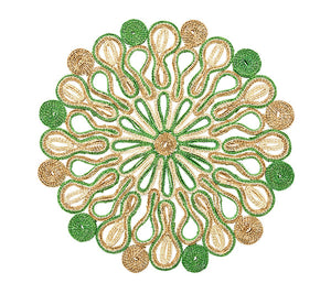 The Marisol Placemat Collection by Kim Seybert features a circular woven table mat with green and natural brown loops and coils in a symmetrical, floral-like pattern on white.