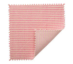 The Kim Seybert Duet Placemat showcases a red and white woven pattern with a folded corner, highlighting its reversible design for a chic table setting.
