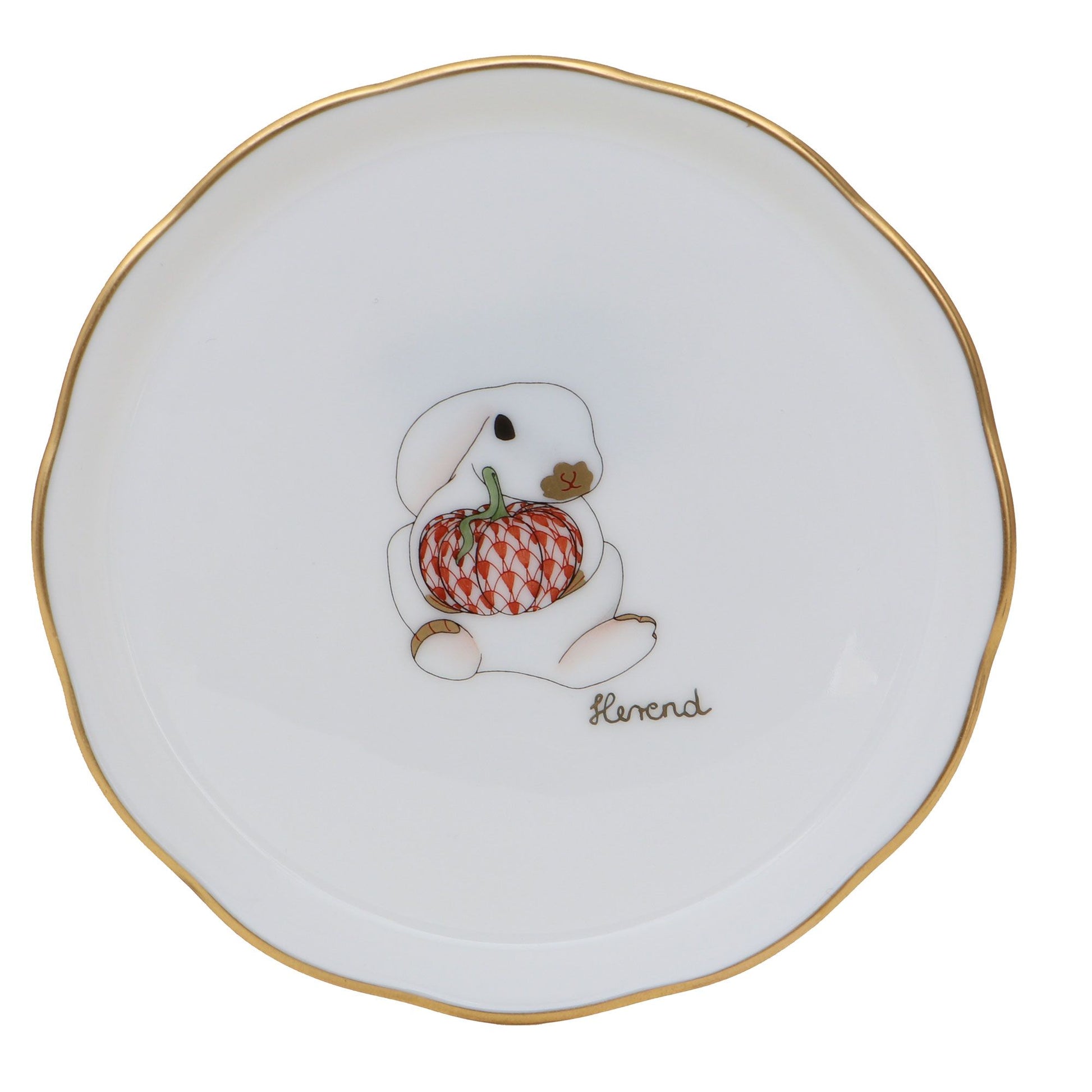 Introducing the Pumpkin Bunny Coaster by Herend: a durable porcelain coaster with a white finish and gold rim, adorned with a hand-painted illustration of a rabbit holding a patterned orange pumpkin, and “Herend” inscribed beneath the design.