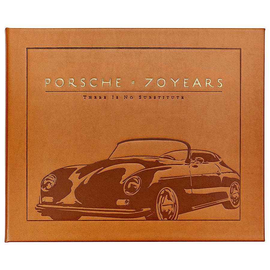 A leather-bound book cover by Graphic Image, titled "Porsche 70 Years: There is No Substitute," featuring a vintage Porsche illustration and chronicling automotive history as detailed by Randy Leffingwell.