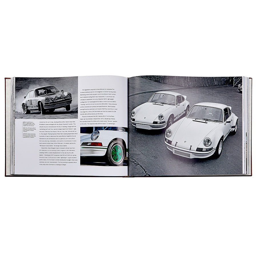 The open book, "Porsche 70 Years: There is No Substitute," by Graphic Image, displays black-and-white images of vintage cars and accompanying text. Randy Leffingwell provides insights into automotive history, with two classic white Porsches prominently featured on the right page.