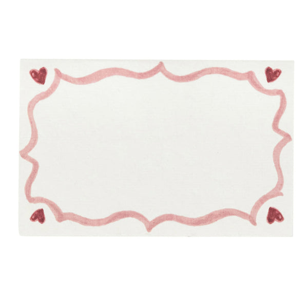 The Juliska Love You More Place Cards, Set of 12, feature a white design with a decorative pink border and hearts in each corner, making them perfect for Valentine's Day.