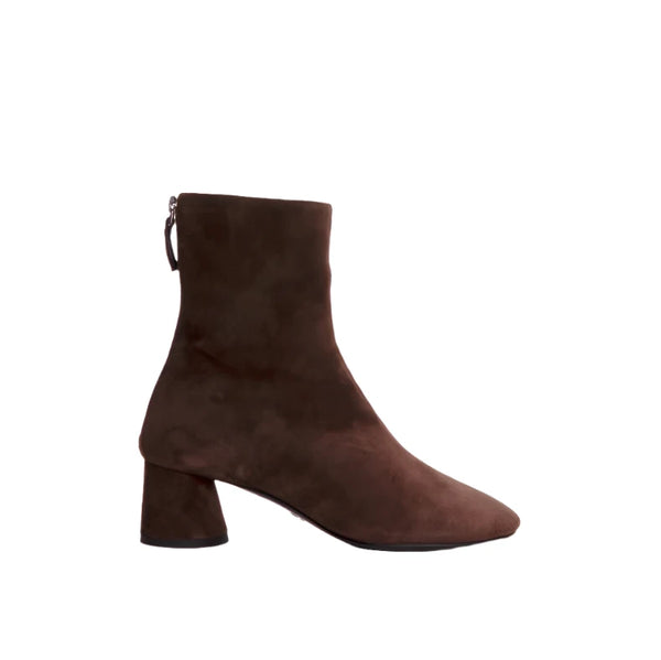 The Proenza Schouler Glove Suede Boot is a brown suede ankle boot designed in the stylish glove boots fashion, featuring a convenient back zipper and a mid-height block heel.