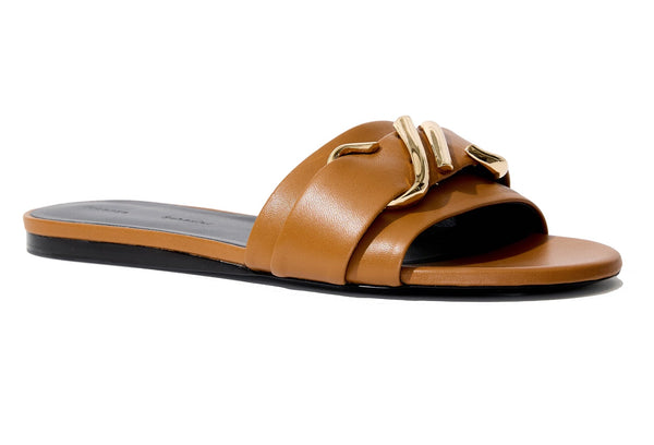 A Proenza Schouler Monogram Slide Sandal, made in Italy, with a gold-tone metal embellishment.