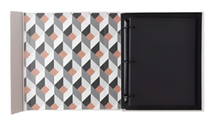 The PrintWorks Family and Friends Photo Album features a black, white, grey, and beige geometric interior and blank high-quality black photo paper for stylish photo storage.