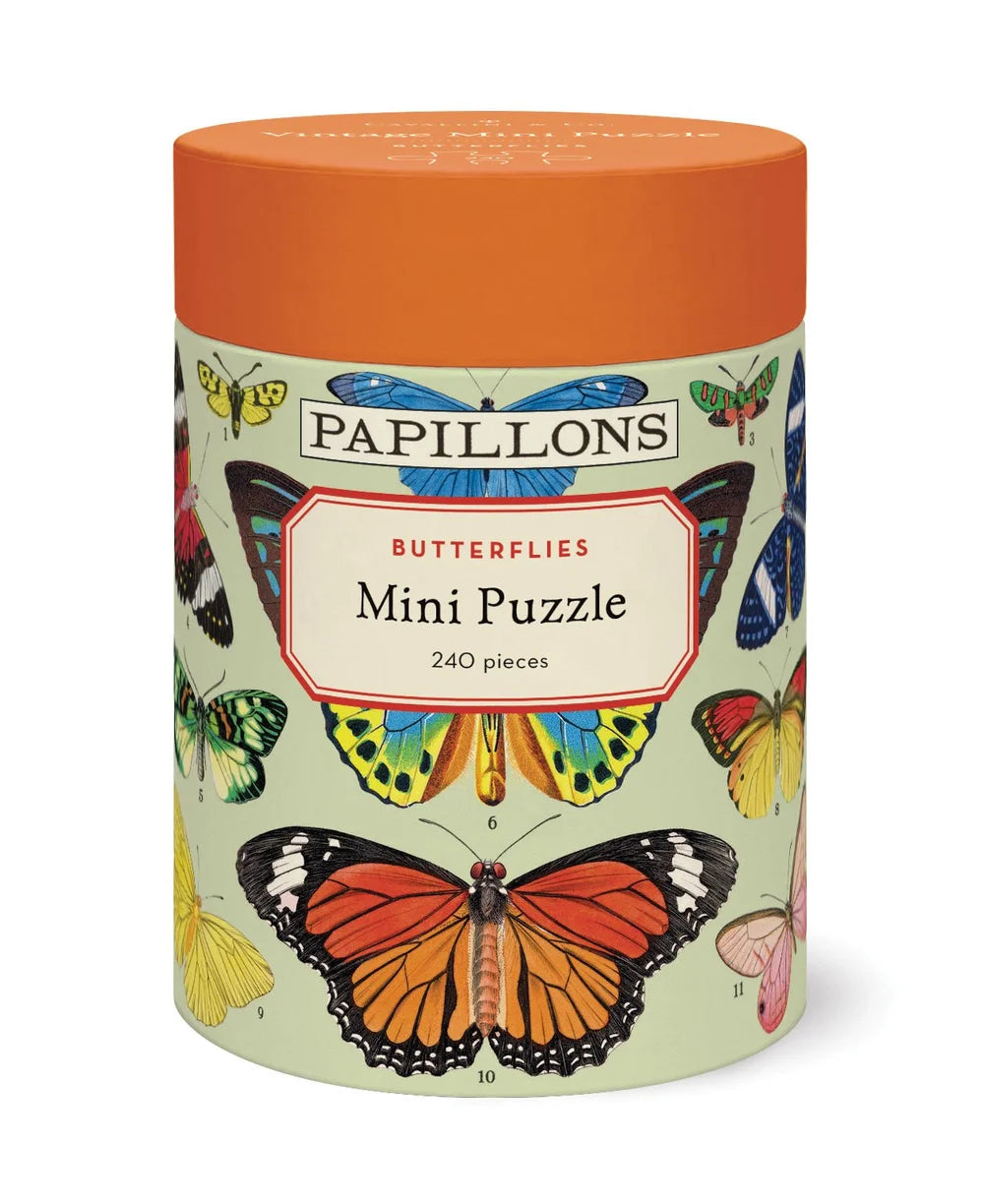 Cavallini Papers and Co's Mini 240 Piece Puzzles come in a cylindrical box with colorful butterfly illustrations on a light green background—ideal for gifting or enjoying a relaxing puzzle session.
