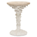 The Palm Drinks Table by Bunny Williams features a round cream stone top with a white sculpted base, elegantly designed to resemble stylized leaves and rocks.