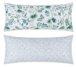 The Reversible Lumbar Pillow Collection by Matouk features two rectangular pillows: one with a green and blue floral pattern, and the other with small blue dots on white—ideal for customizable home decor.