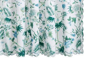 The Matouk Palmyra Shower Curtain in Emerald features green and blue floral and palm frond designs with scalloped edges, making it a stylish match for tropical print bedding or Egyptian cotton percale sheets.