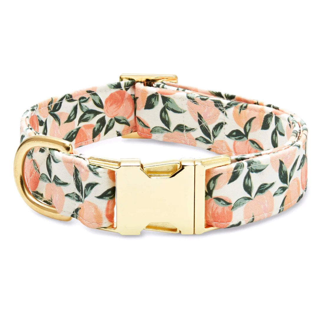 The Foggy Dog Fabric Dog Collar features a chic peach and green floral design with elegant gold hardware, including a metal buckle and D-ring.