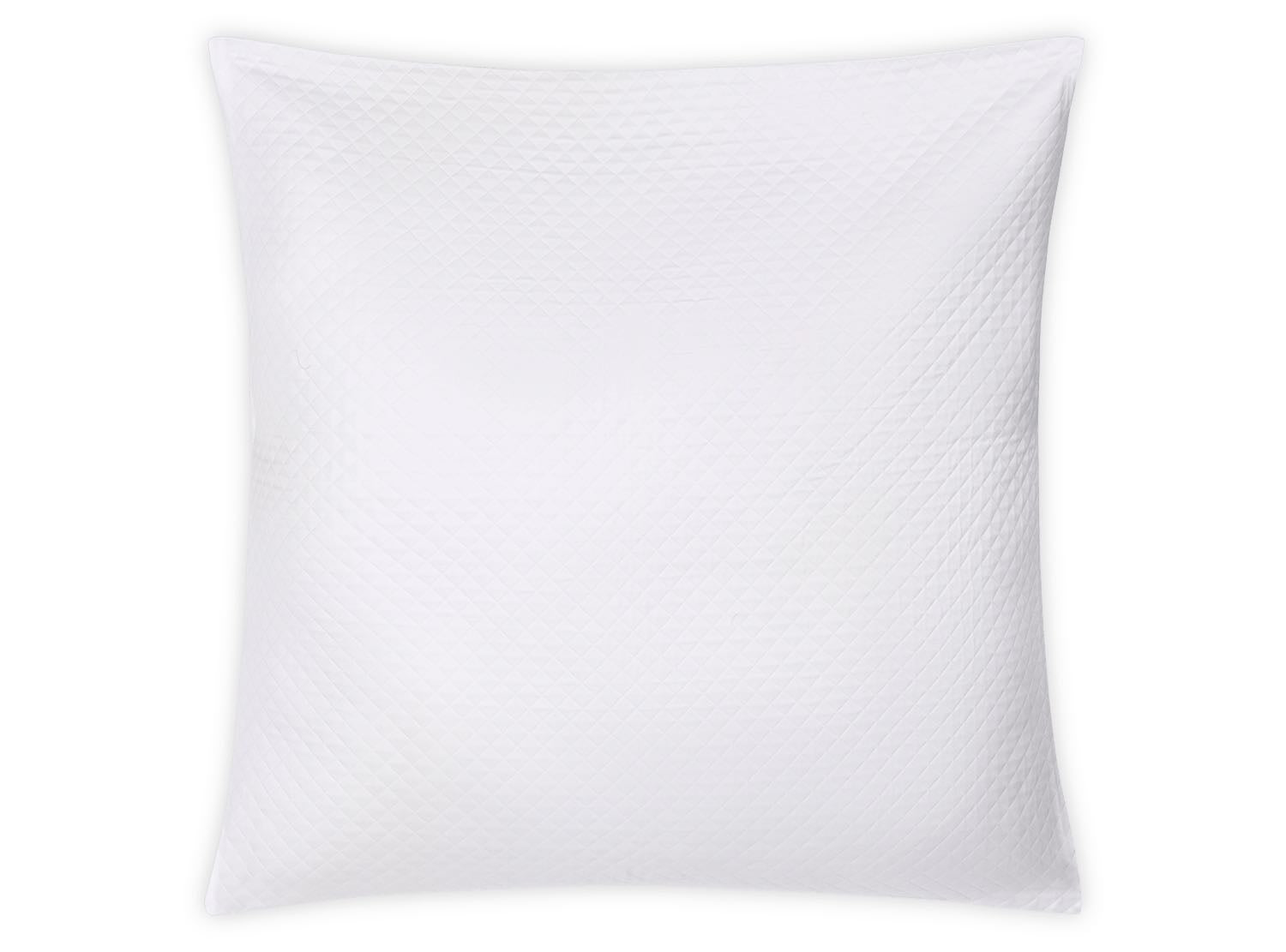 The White Petra Bedding Collection pillow by Matouk features soft cotton with a subtle matelassé diamond pattern, shown here in a square, white design against a plain white background.