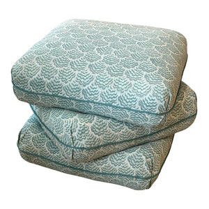 The Ashley Ottoman in Jhinuk Teal by Sherrill/Mr & Mrs Howard, styled for sophisticated interiors, is showcased against a white background.