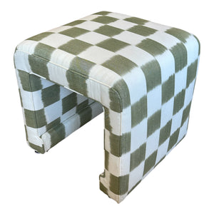 The Willow Ottoman by Century Furniture features a green and white checkerboard fabric, U-shaped base, and simple modern design for timeless elegance.