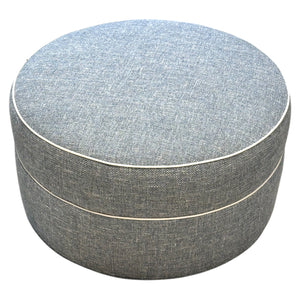 The Ottoman in Rosmar Blue by Lee Industries features a round silhouette and subtle piping, adding elegant style to any space.