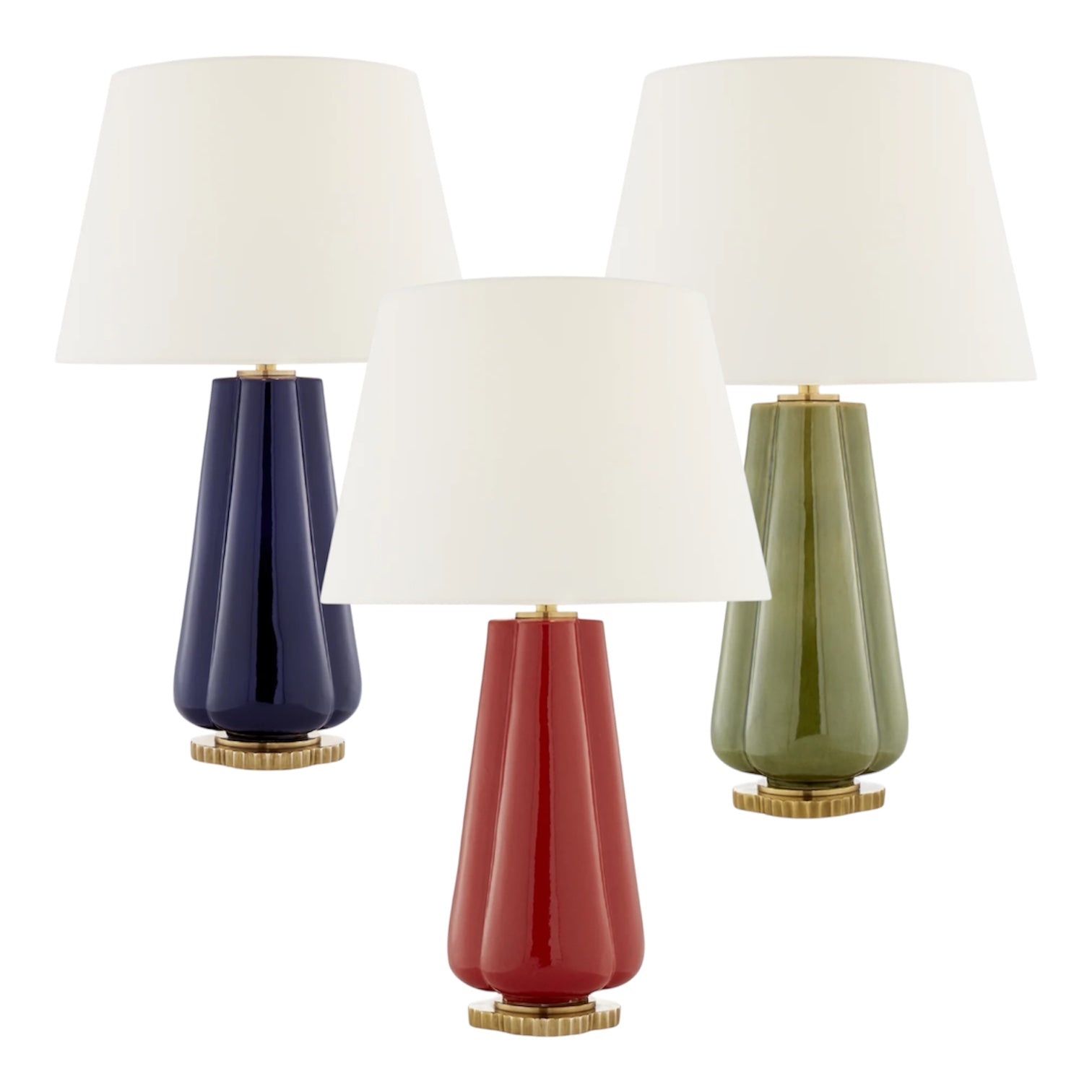 The Penelope Table Lamp Collection by Visual Comfort offers modern lamps with white shades and ceramic bases in navy blue, olive green, and red, all set on gold-toned circular bases for a stylish accent.