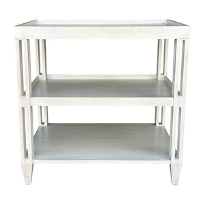 The Rennie’s Side Table from Sherrill/Mr & Mrs Howard features two shelves, a light wood finish, and an open slatted frame—adding natural texture and a versatile rectangular design to any interior.