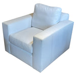 The Gregoire Swivel Chair by Verellen features a modern square silhouette, white upholstery, thick seat and back cushions, wide armrests, and a sturdy frame made from sustainably harvested hardwood.
