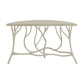 The Hidcote Console Table by Currey and Company features a cream-colored faux bois finish, a smooth top, and a base designed to look like intertwining tree branches.