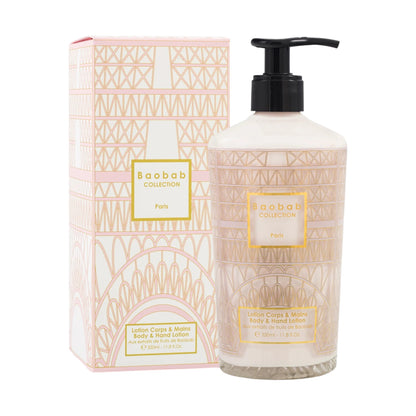 A Baobab Paris Body Wellness Collection lotion with pump dispenser sits beside its matching decorative box, both infused with the delicate Paris fragrance.