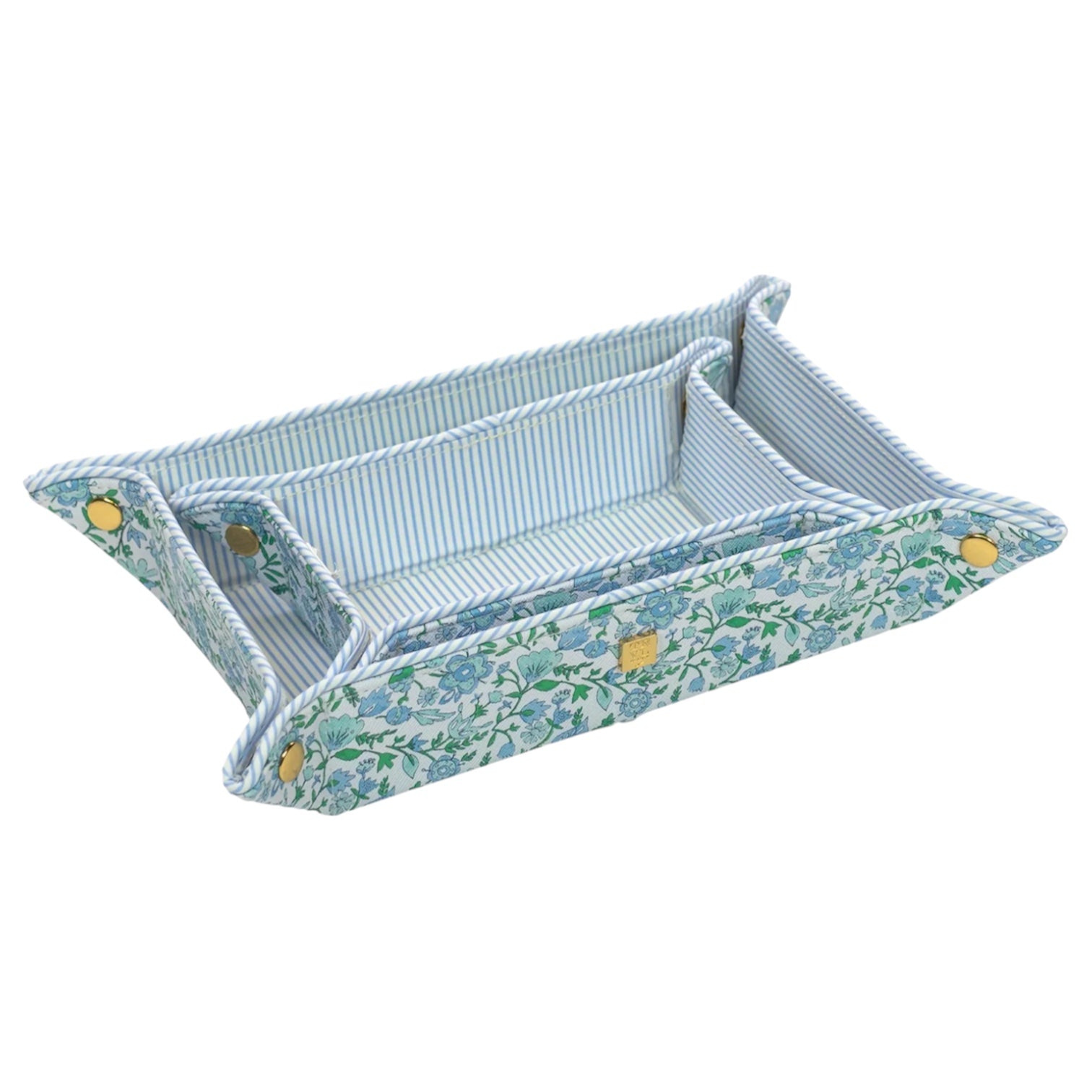 The TRVL Design Luxe Saffiano Tray Set includes two nested rectangular trays with floral and striped patterns, corner snaps, and rope trim—perfect for stylish pocket organization.