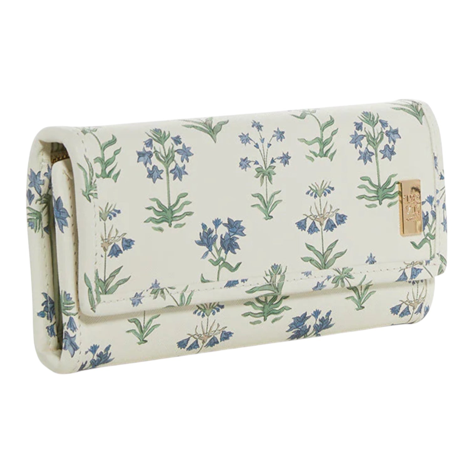 The TRVL Design Luxe Jewelry Wallet is cream-colored with a blue and green floral pattern and a gold emblem on the flap, making it an elegant, stylish travel jewelry organizer.