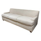 The Yves Sofa by Baker is a three-seat beige luxury sofa featuring square arms and a minimalist design, highlighted by its quality construction against a white background.