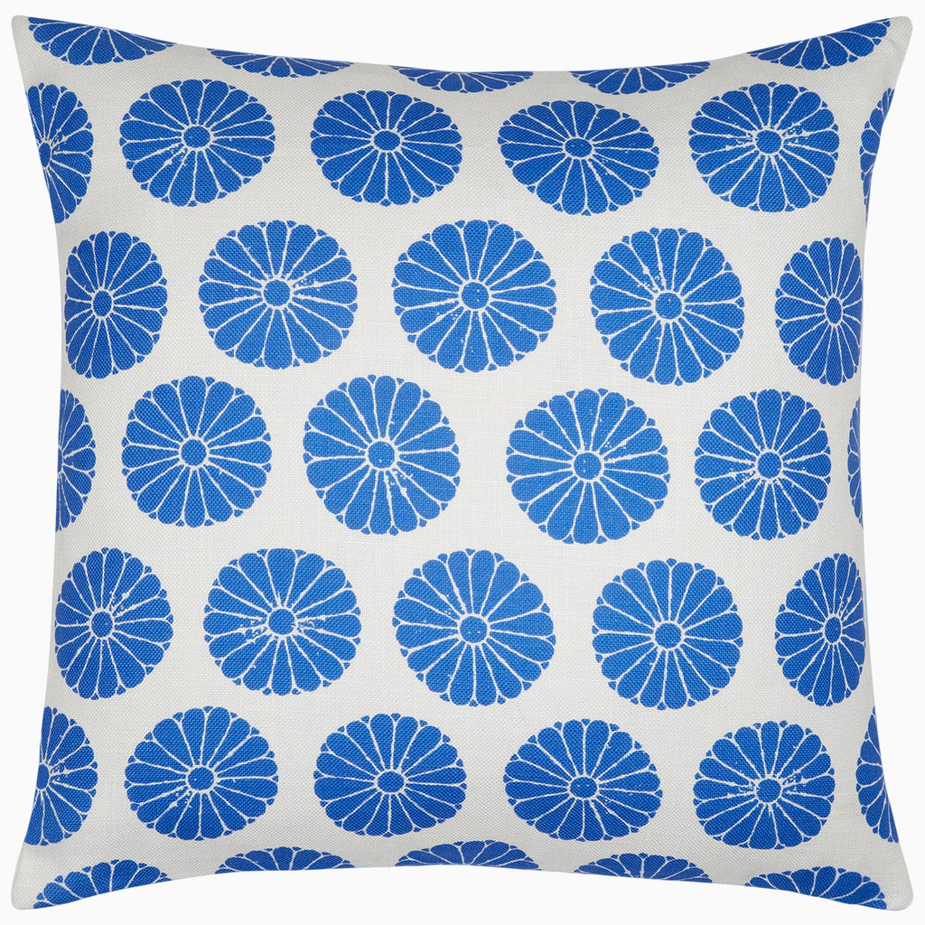 The Aleesa Outdoor Pillow by John Robshaw features a white background with blue circular floral patterns and is crafted to resist sun and rain.