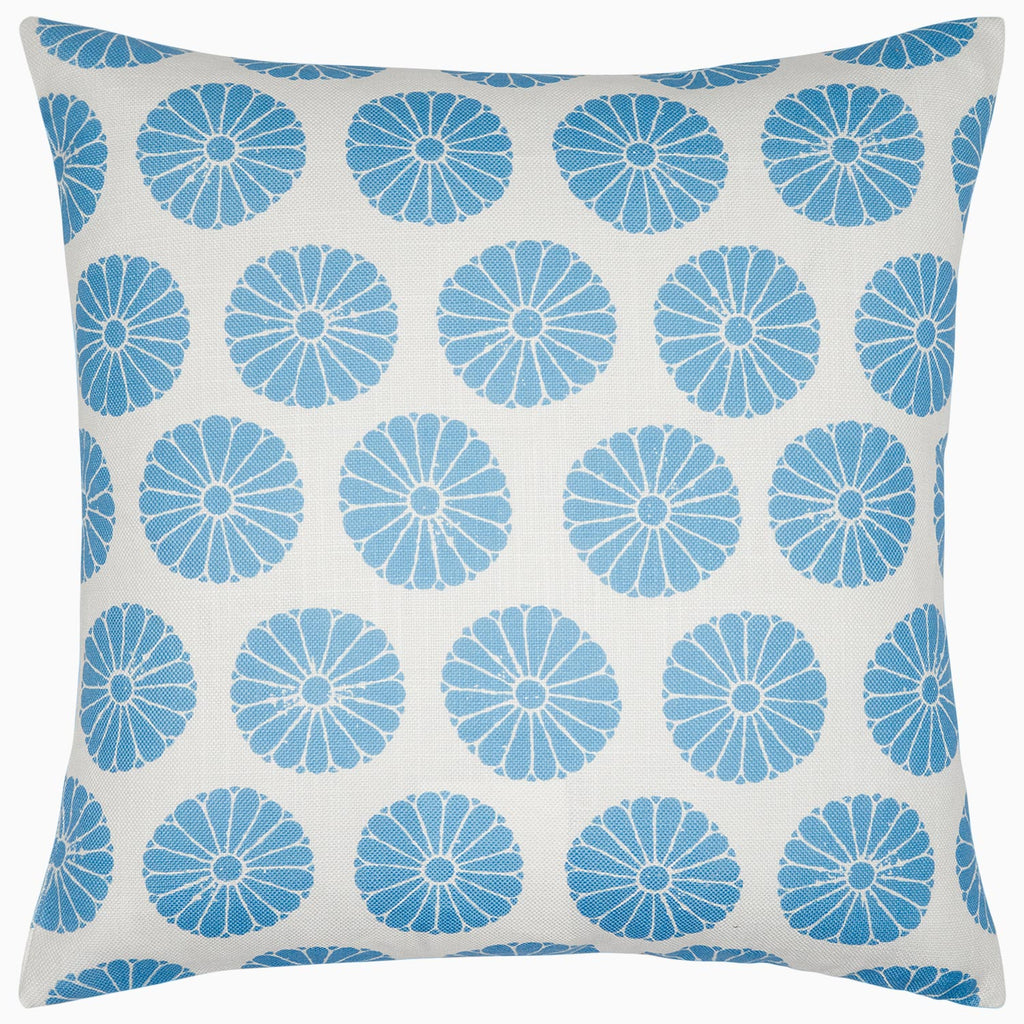 The Aleesa Outdoor Pillow by John Robshaw is a square white pillow with rows of blue circular floral designs. Rain and sun resistant, it's perfect for adding style and durability to your outdoor space.