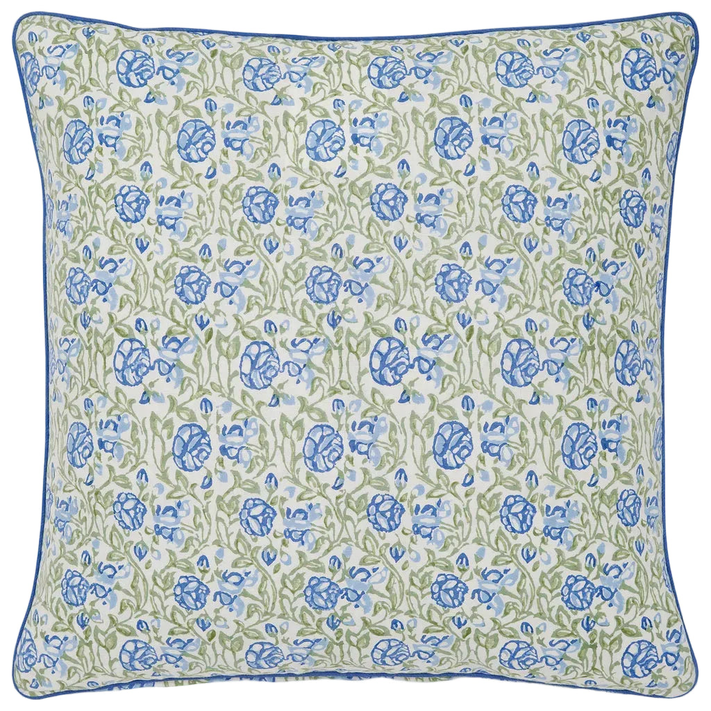 The Amit Pillow by John Robshaw features a blue and green floral pattern on white, accented with blue piping. This decorative pillow adds a fresh touch to any space.