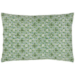 The Ankur Kidney Pillow by John Robshaw is a rectangular pillow adorned with green and white hand-printed florals, medallions, and small smiling face motifs repeated across its surface.