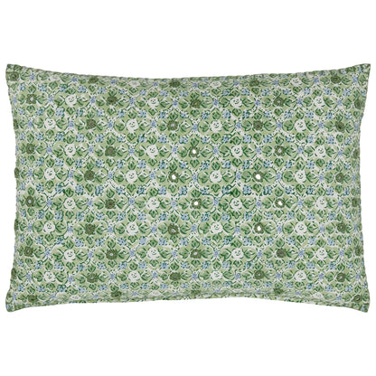 The Ankur Kidney Pillow by John Robshaw is a rectangular pillow adorned with green and white hand-printed florals, medallions, and small smiling face motifs repeated across its surface.