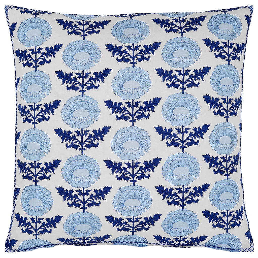 The Kaavia Indigo Pillow by John Robshaw features a white background with repeating blue floral block print patterns and blue edging, inspired by the elegance of Jaipur’s palace gardens.