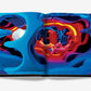 Open book displaying a colorful, psychedelic room with tubular shapes and a person lounging inside, evoking the vibrant spirit of 1960s and ’70s pop culture in a Pop Art Style by Assouline.