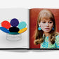 Open book showing a multi-colored disk chair on the left page and a woman with straight hair, wearing green polka-dotted attire and blue earrings on the right page, evoking the vibrant Pop Art Style by Assouline reminiscent of 1960s and ’70s pop culture.