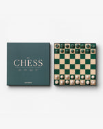 The PrintWorks Chess Collection features modern green and cream pieces on a matching board, ideal for coffee table games, and comes in a box labeled "CHESS.