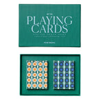 The PrintWorks Playing Cards set includes two geometric-design decks—one orange and light blue, the other blue and dark blue—placed side by side in a green box labeled "Playing Cards.