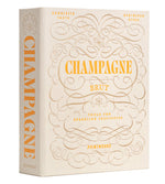 A beige box with ornate gold text, labeled "The Essentials Champagne Tools" by PrintWorks, includes a premium Champagne Opener for sparkling festivities and celebrations.