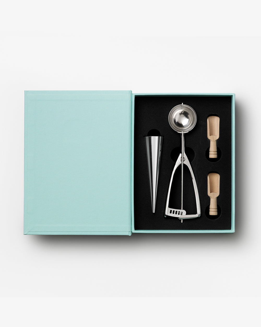 The Essentials Ice Cream Tools by PrintWorks includes an ice cream scoop, metal cone, and two wooden-handled stainless steel tools in a black foam insert—everything you need for your next ice cream party.