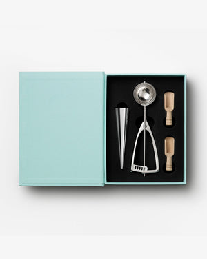 The Essentials Ice Cream Tools by PrintWorks includes an ice cream scoop, metal cone, and two wooden-handled stainless steel tools in a black foam insert—everything you need for your next ice cream party.